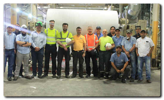 A happy startup team with members from Valmet and Alas Doradas in front of the first jumbo roll on January 23.